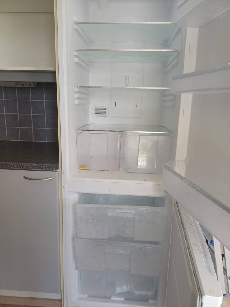 Refrigerator interior before cleaning