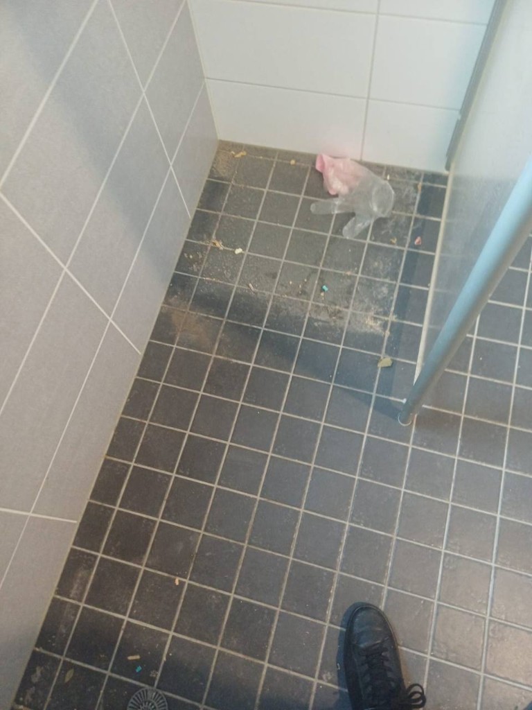 Shower floor before cleaning