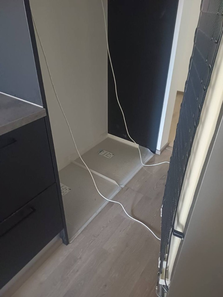 Area under refrigerator after cleaning